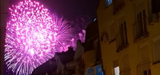 Fireworks Over City Street At Night